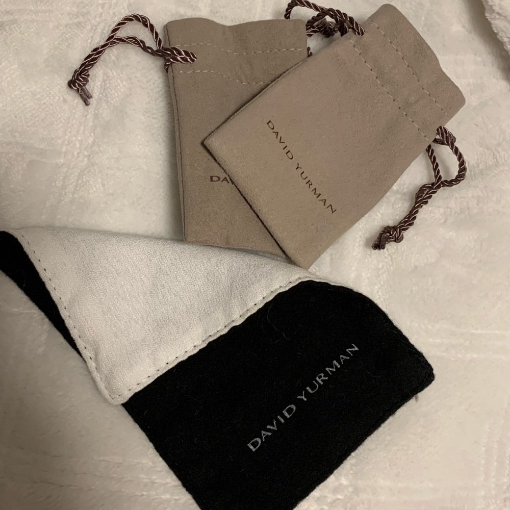 2 David yurman bags and cleaning cloth
